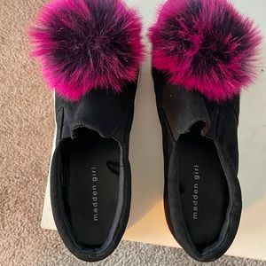 Steve Madden canvas slip-ons, black with white soles and pink pom poms. Size 9.5